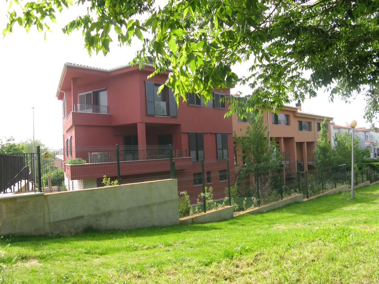 backyard architectural detail and landscaping to red urban villa